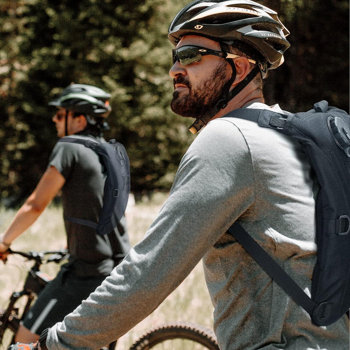 Durable tactical hydration backpack with 0.8-gallon water bladder for hiking, camping, and adventure.
