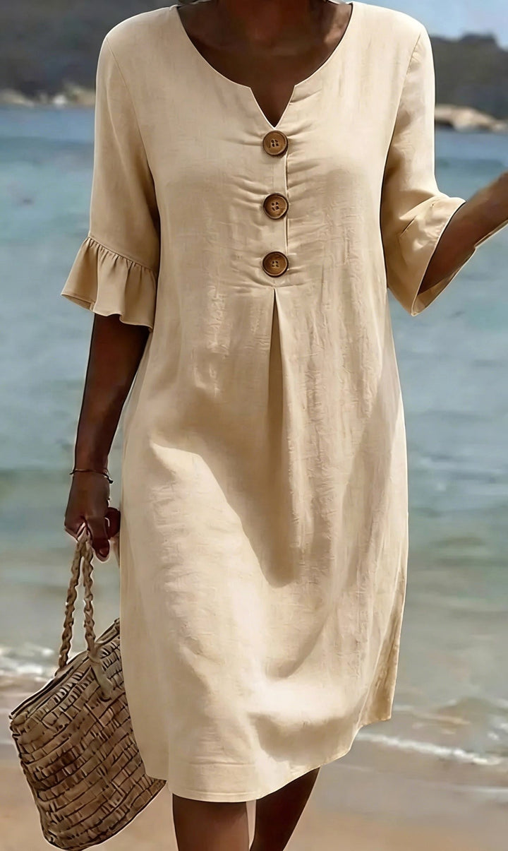 Effortless women's shirt dress with flutter sleeves & button front, ideal for spring & summer styling.
