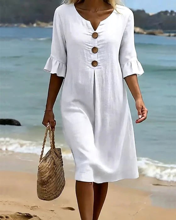 Casual women's shirt dress with elegant flutter sleeves & full button-front closure.