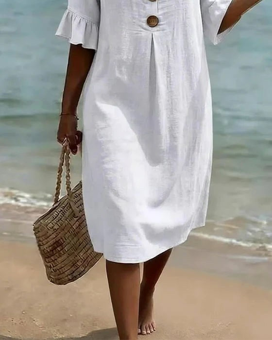 Relaxed fit women's button-front shirt dress with flutter sleeves, versatile & comfortable.
