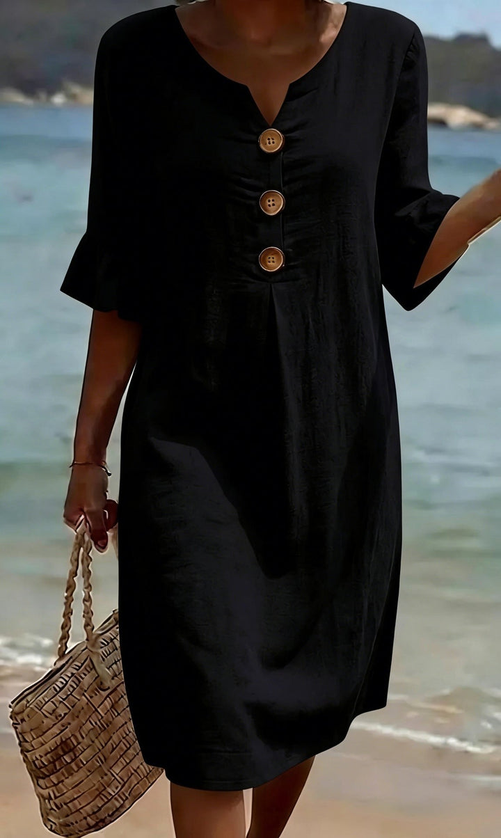 Elegant women's flutter-sleeve shirt dress, button-front design for versatile spring fashion.