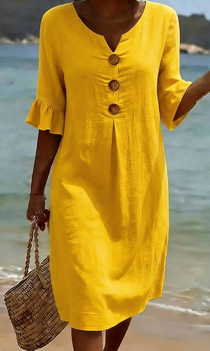 Women's button-front shirt dress, featuring chic flutter sleeves; a versatile day dress.