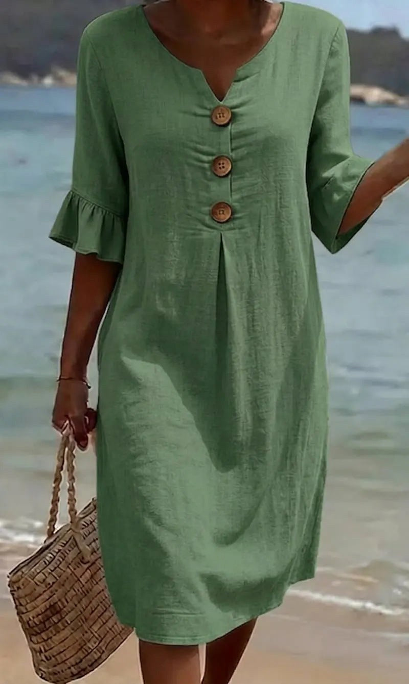 Spring/summer women's shirt dress, comfortable flutter sleeves & button front for effortless style.