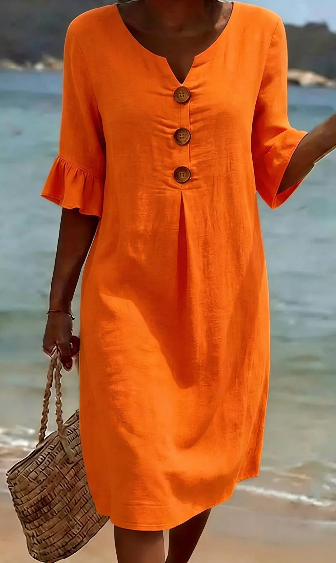 Women's flutter-sleeve button-front shirt dress, perfect for casual or elegant warm weather.