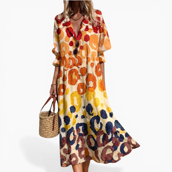 Women's relaxed fit shirt dress with a bold, vibrant print and full button front, perfect for casual summer wear.