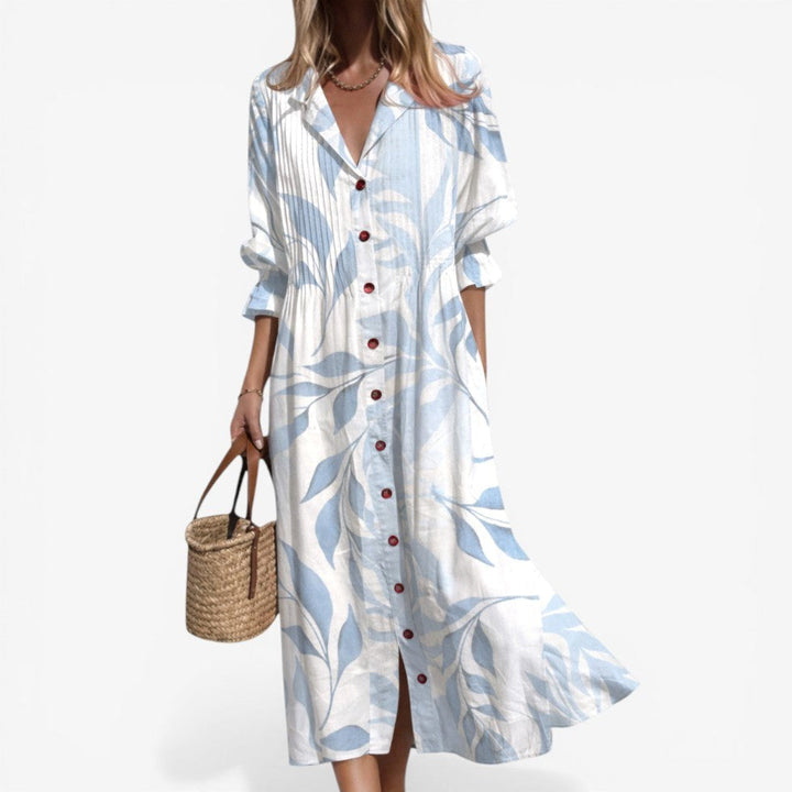 Front view of women's relaxed midi shirt dress with an all-over bold pattern and classic button-down closure.