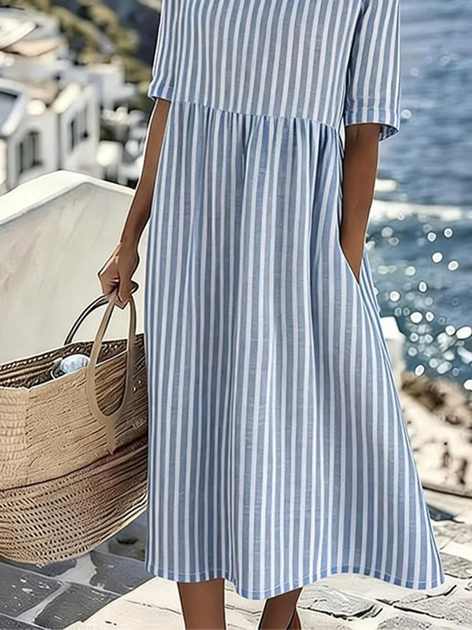 Comfortable striped midi dress for women. Features a relaxed, flowing fit, ideal for spring, summer, and everyday style.