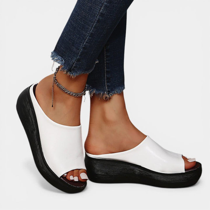 Woman wearing Tahnee orthopaedic slip-on sandals, demonstrating everyday comfort and supportive style.