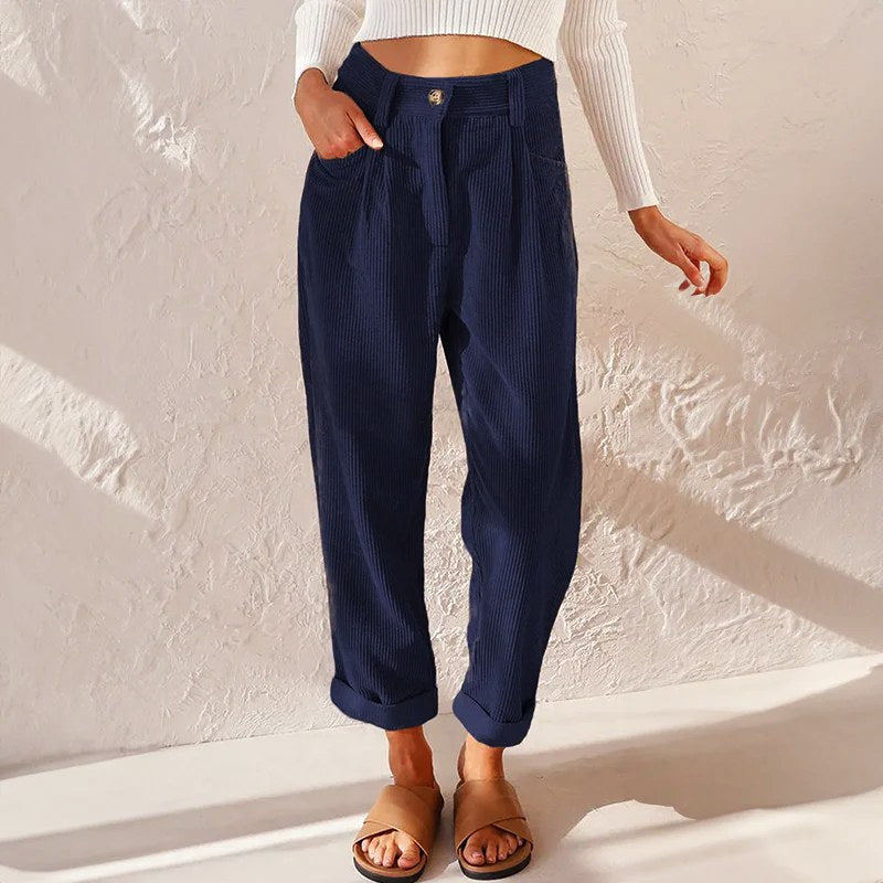 Flowy women's wide-leg pleated trousers, comfortable high-waist design for stylish casual or office wear.