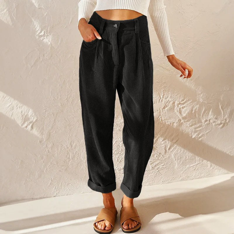 Relaxed fit women's high-waist wide-leg pleated pants, combining comfort with modern office style.