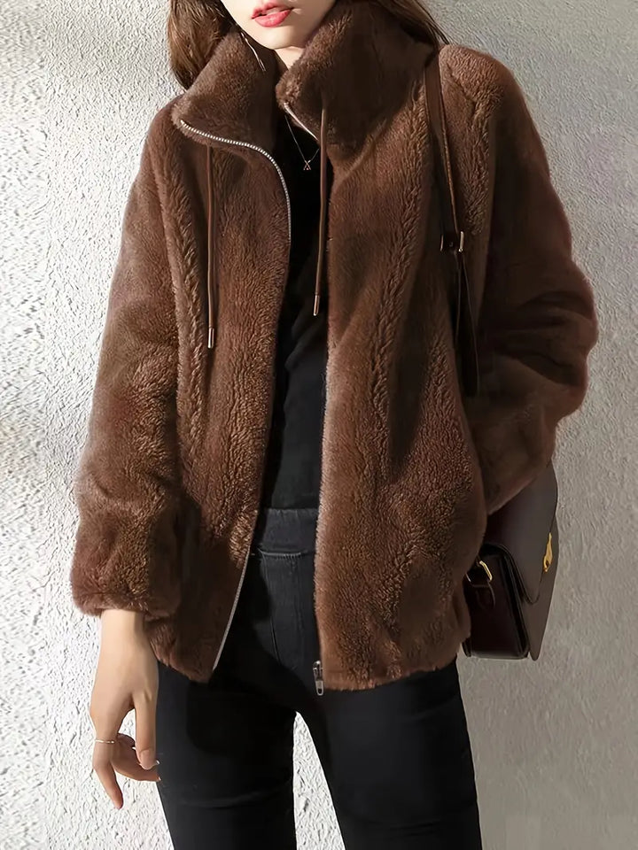 Cozy women's plush Isla Teddy Coat, a comfortable drawstring & zipper jacket perfect for cold weather & warmth.