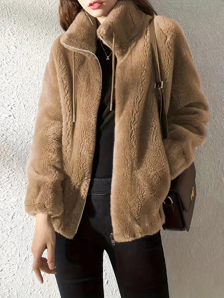 Isla Teddy Coat: Women's plush jacket with drawstring & zipper, providing ultimate winter warmth & fashionable comfort.