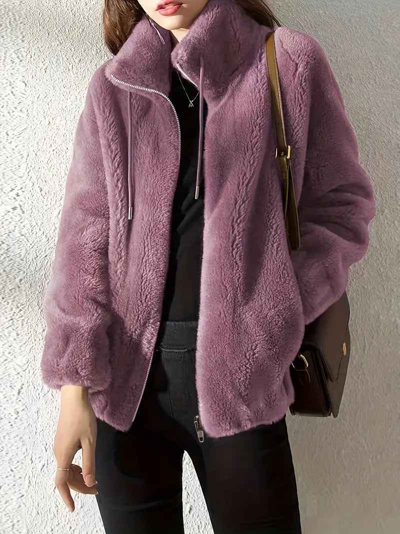 Stylish women's Isla Teddy Coat, a warm plush jacket with drawstring and zipper, ideal for fall & winter fashion.