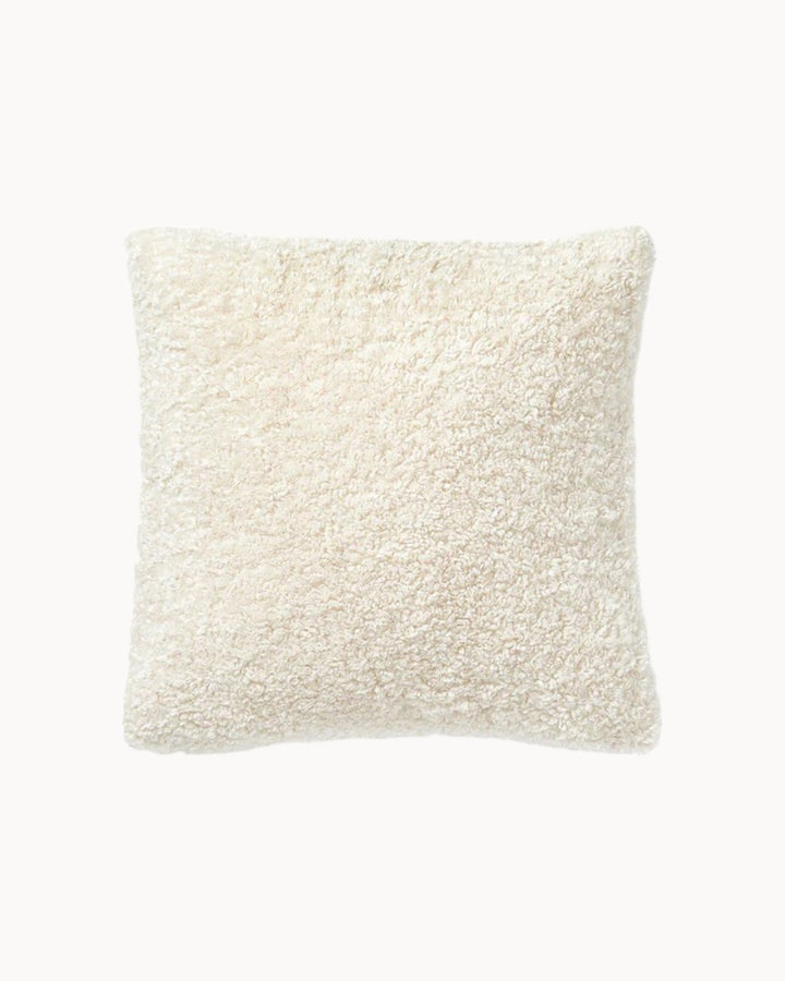 Soft taupe plush teddy pillow cover, a fluffy textile accent for stylish home comfort.