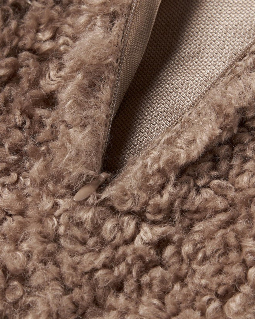 Stylish plush teddy cushion cover in a beige tone, perfect for a cozy and modern home.