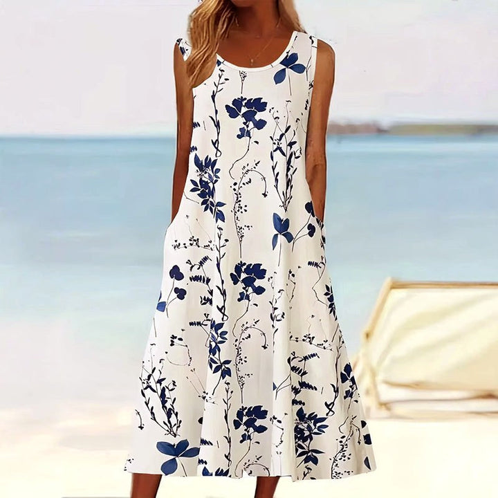 Elegant women's floral print A-line midi dress with convenient pockets, perfect for summer casual or semi-formal events.