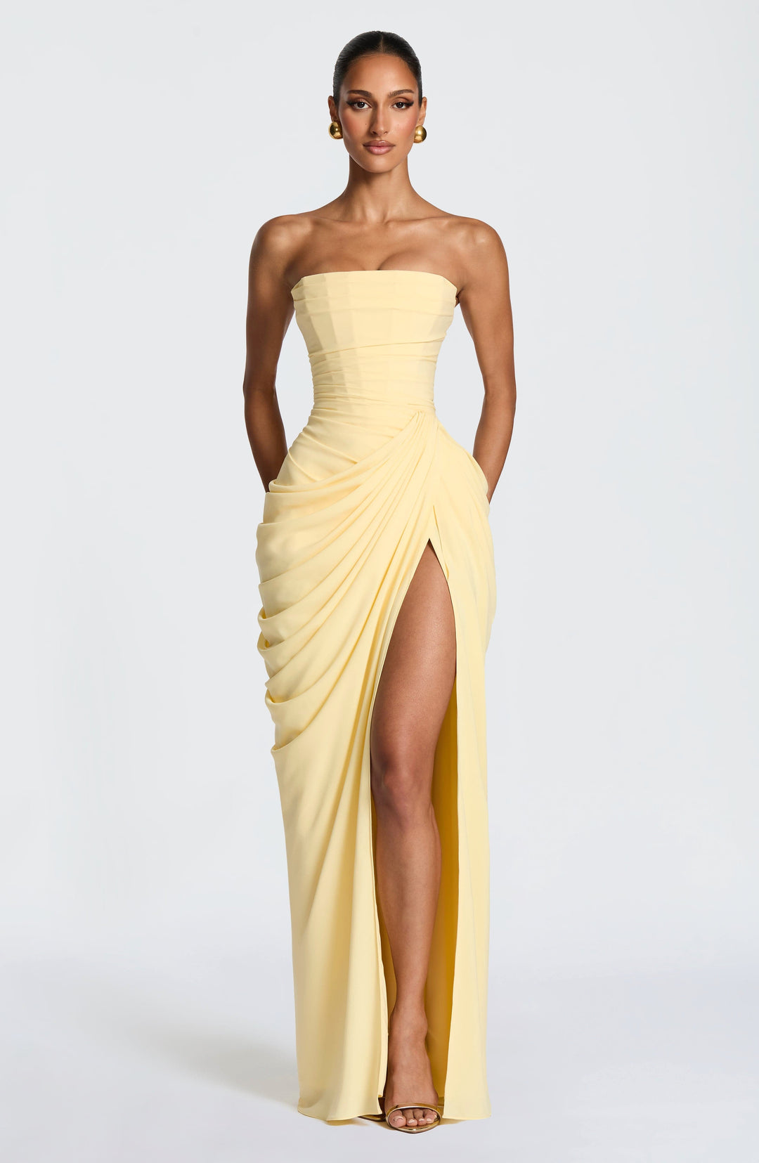 Elegant women's strapless maxi evening dress with a sophisticated sculpted bodice, perfect for formal events.