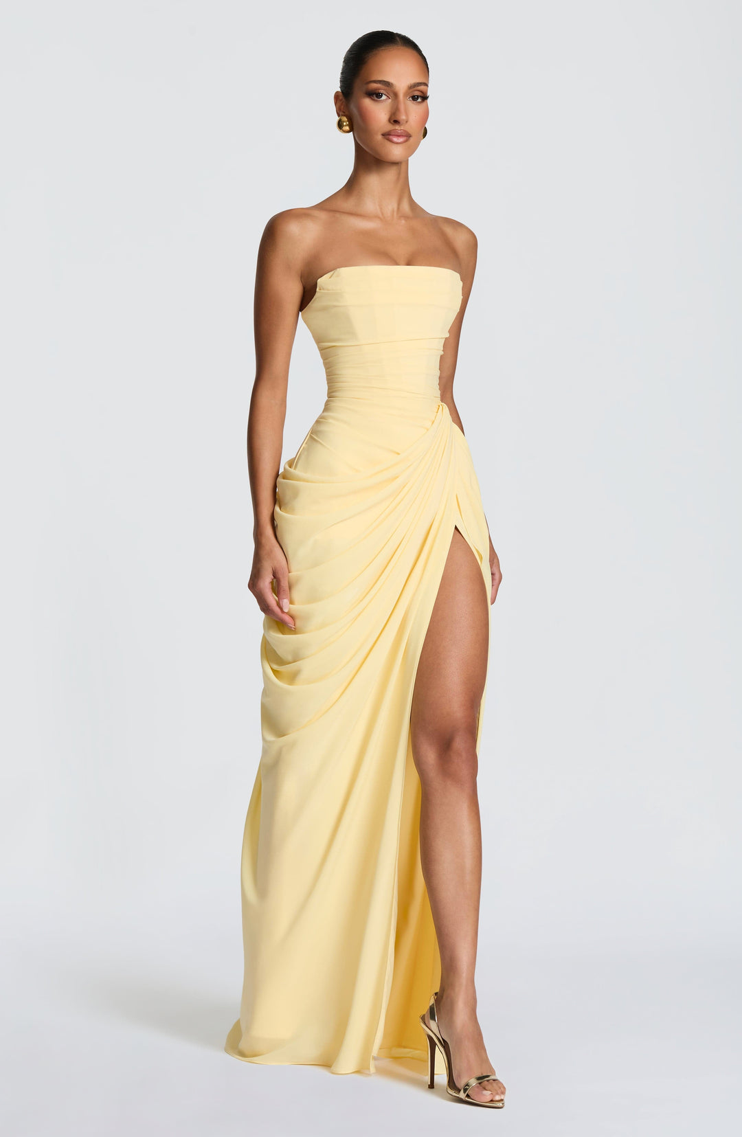Long strapless evening gown for women, designed with a chic sculpted bodice. A beautiful formal party dress.