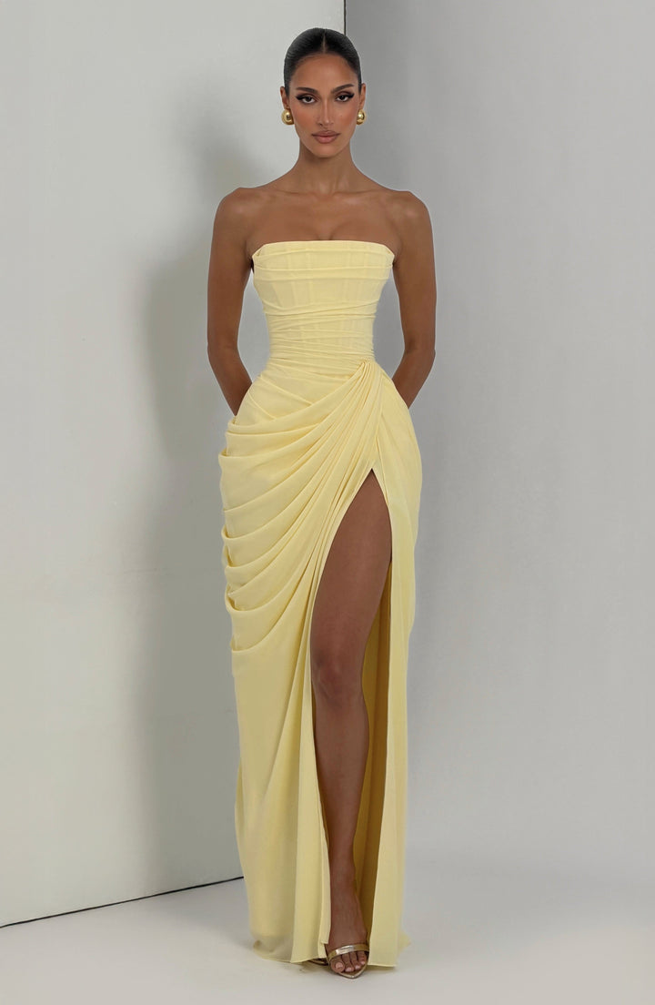 Back view of a women's strapless maxi evening dress, featuring intricate back lace detail and sculpted bodice.