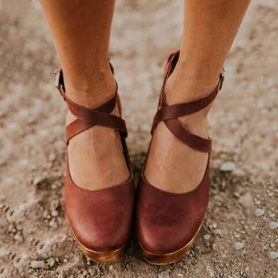 Classic closed-toe wedge heels for women, featuring a chic ankle strap for an elegant and comfortable look.