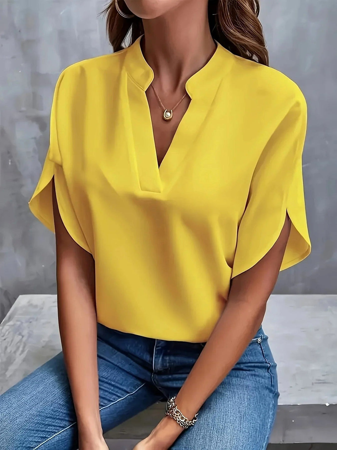 Versatile women's long sleeve tailored blouse, a modern top for elegant work or smart casual style.