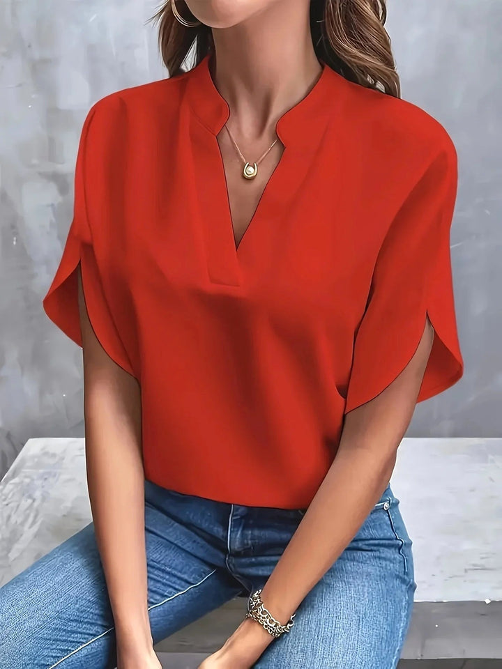 Professional women's tailored long sleeve blouse, essential workwear for a polished and modern office look.