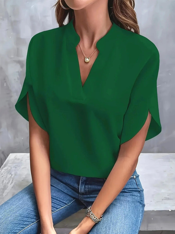Modern women's tailored long sleeve blouse, offering an elegant fit for professional and smart casual occasions.