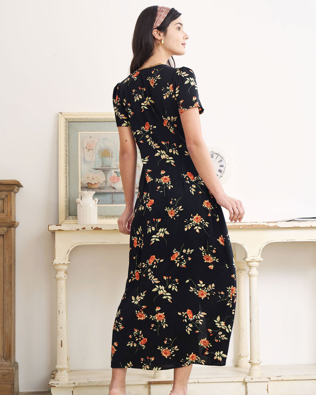 Vibrant floral short-sleeve V-neck maxi dress. Flowy style for elegant women's summer fashion.