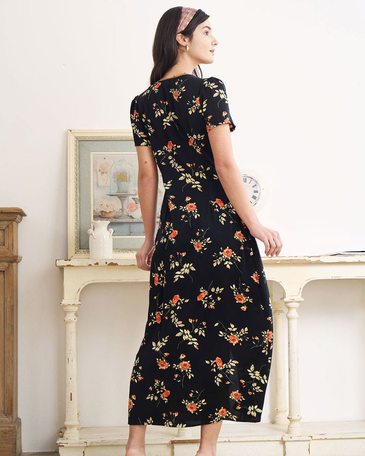 Vibrant floral short-sleeve V-neck maxi dress. Flowy style for elegant women's summer fashion.