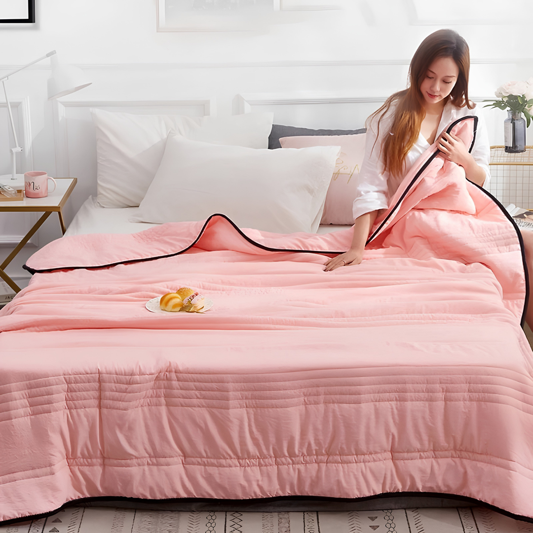 Experience ultimate heat relief with this ultra-cooling comfort blanket, ideal lightweight summer bedding for night sweats.