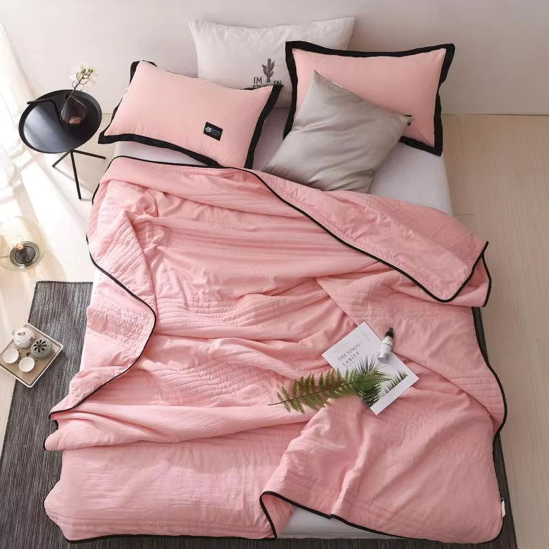 Cozy yet cooling comfort blanket, a soft home essential for peaceful sleep, tackling night sweats & summer heat.