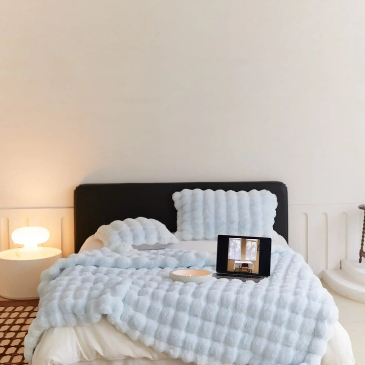 Velvety soft plush throw blanket for ultimate cozy warmth. A comfortable addition to any home living space.