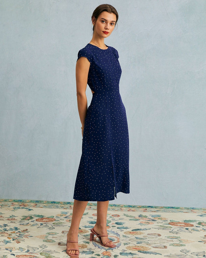 Flattering A-line polka dot midi dress for women. Navy blue with elegant cut-out & cap sleeves. Office chic.