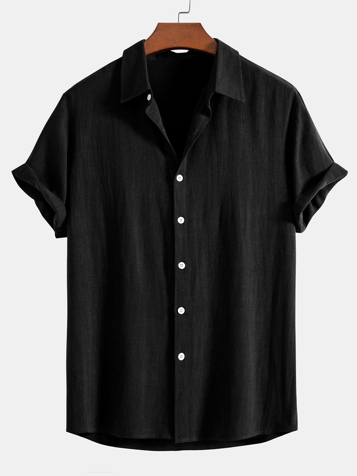 Versatile men's button-front short sleeve shirt, relaxed fit, ideal for a smart casual summer outfit.