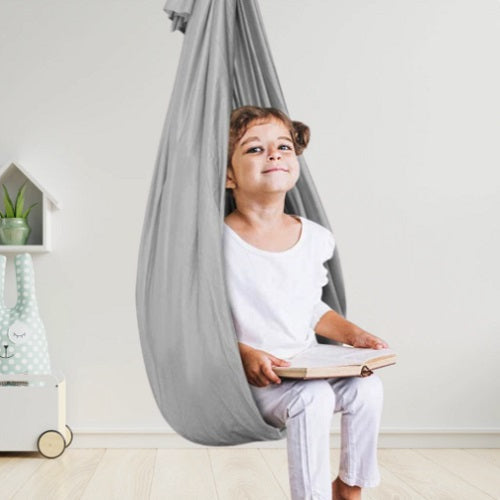 Kids' therapy swing promotes sensory integration, focus, and calm. Perfect for a playroom or special needs child.