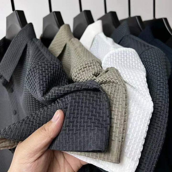 Close-up of men's textured short sleeve polo fabric, comfortable for summer.