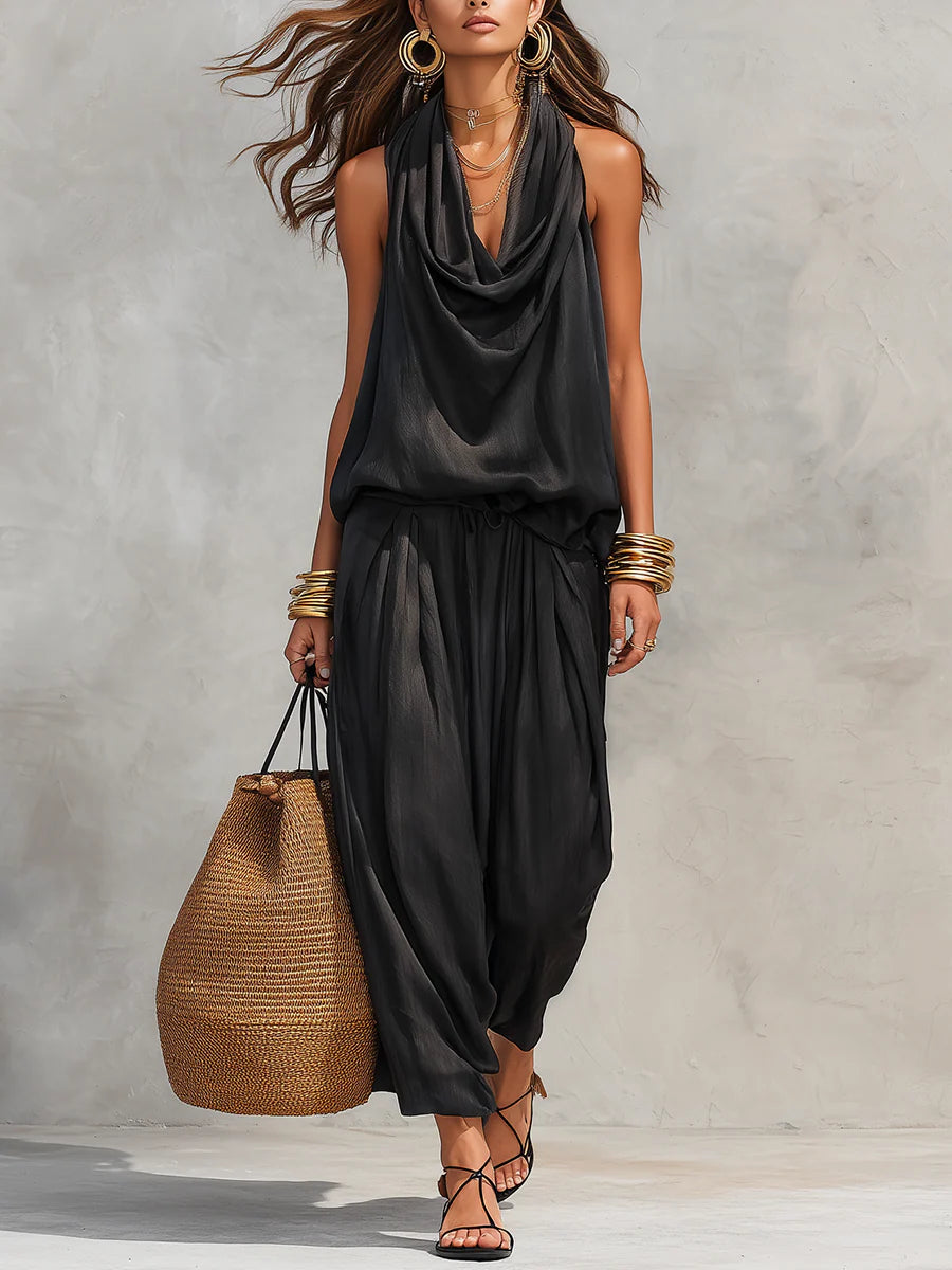 Elegant women's two-piece set featuring a cowl neck halter top and wide-leg pants. Perfect for stylish summer occasions.