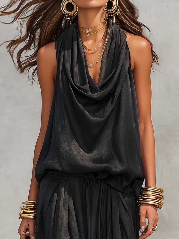 Elegant women's two-piece set, featuring a halter cowl neck top and wide-leg pants. Ideal for casual or dressy events.