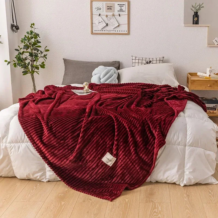 WarmHaven cozy flannel blanket draped over a sofa, ideal autumn decor for a comfortable living room.