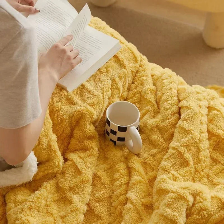 Comfortable lambswool & fleece throw, insulated and soft, offering cozy warmth for winter home decor.