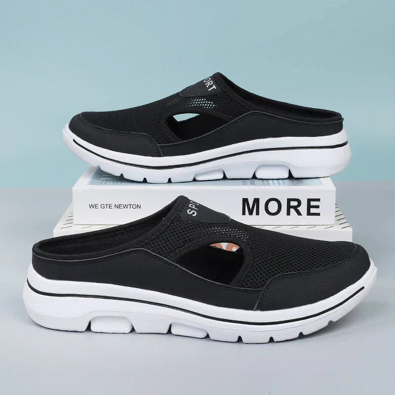 Men's black orthopedic slip-on shoes with arch support, cushioned sole for all-day comfort & foot relief.