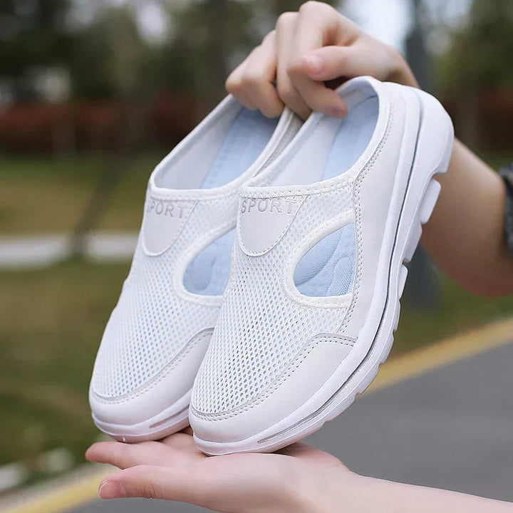 White orthopedic men's shoes, easy slip-on, featuring cushioned sole & breathable design.
