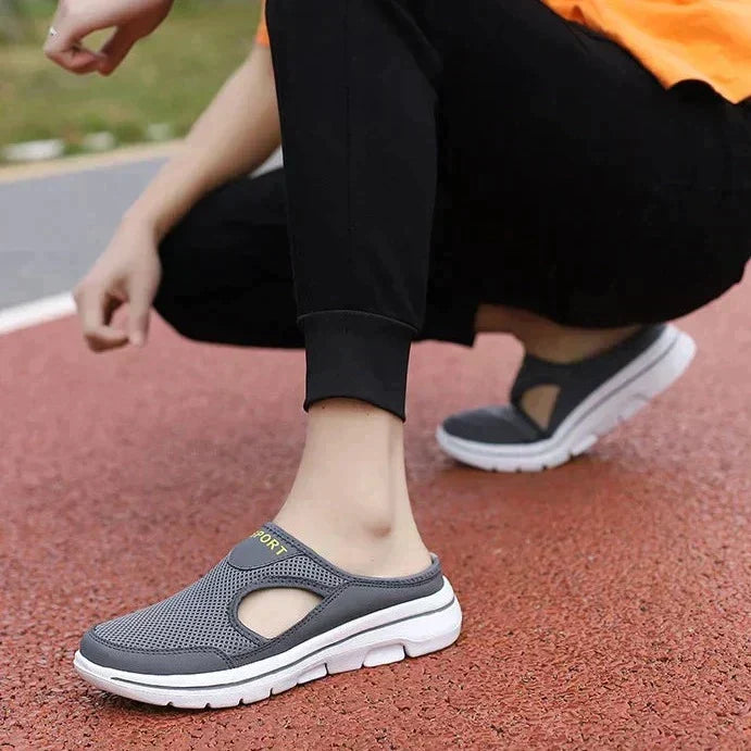 Casual black men's orthopedic footwear, offering arch support, breathable comfort & easy wear.