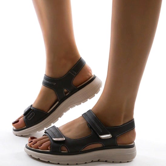 Comfortable women's orthopedic sandals, featuring supportive flat straps & arch support for everyday wear.
