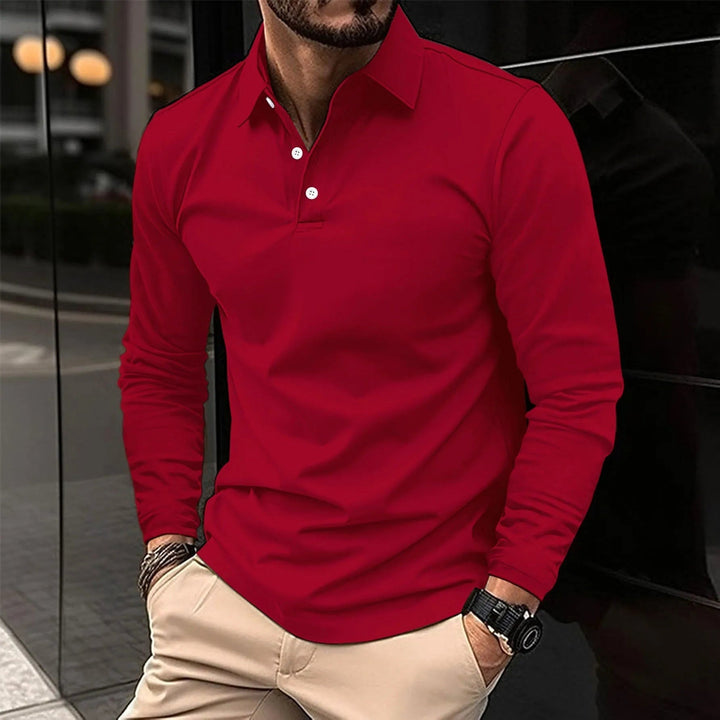 Neatly folded men's long-sleeve polo shirt. Classic button-up collared top offers everyday comfort and style.