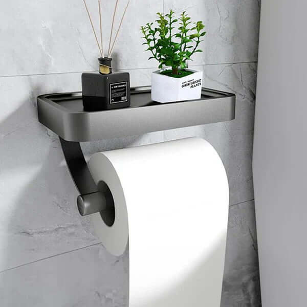 Space-saving toilet paper roll holder, wall mount, includes a shelf for extra bathroom storage.