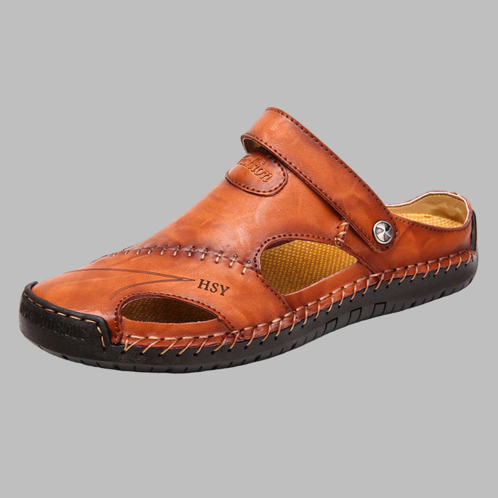 Stylish men's polished slip-on slides with detailed stitching. Perfect casual closed-toe summer footwear for men.