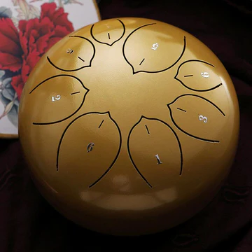 Steel tongue drum, 6-inch, for peaceful relaxation, meditation, and sound healing. Creates tranquil, calming music.