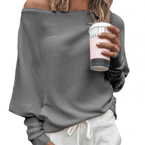 Cozy women's knitted off-shoulder sweater. Long-sleeve design for stylish comfort and winter fashion.