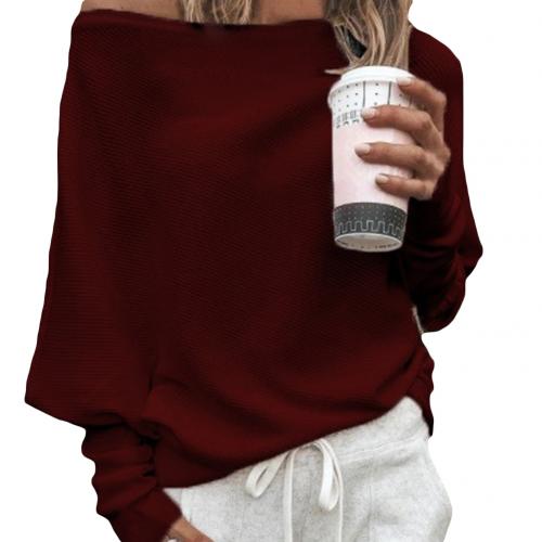 Warm women's off-shoulder knitted sweater. Comfortable long-sleeve top for trendy winter fashion and elegant style.